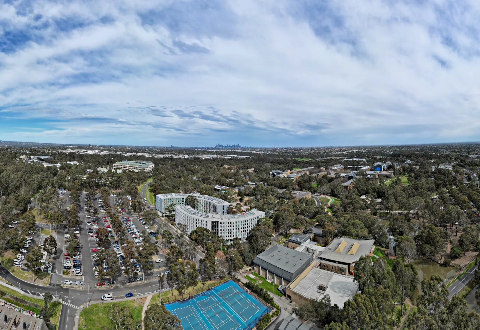 Aerial view of La Trobe University’s Bundoora campus in Melbourne’s outer north, facing the city skyline